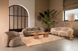 Beige polyester vloerkleed Curvae van 109x238 cm in een stijlvol modern interieur met zachte texturen.