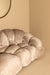 PTMD Nubibus 3-zitsbank in beige polyester met een zachte, gewatteerde organische vormgeving.