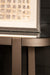 PTMD Yozan bijzettafel met bruin metalen frame en houten blad van 44x160 cm.