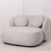 Luxe crèmekleurige PTMD fauteuil van polyester met ronde vormen en twee bijpassende kussens, 116x122 cm.