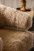 PTMD fauteuil in crème polyester met een zachte, hoogpolige textuur en een comfortabel, modern design.