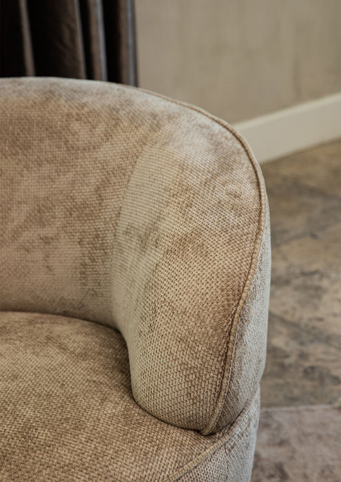 Beige fauteuil Filou van PTMD met gestructureerde polyester bekleding en een modern, rond ontwerp.
