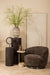 Bruine Filou fauteuil van PTMD met polyester bekleding en een slank metalen onderstel in een sfeervol interieur.