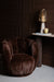 Bruine PTMD Furia fauteuil met zachte, bontachtige polyester bekleding en een stijlvol, rond ontwerp.