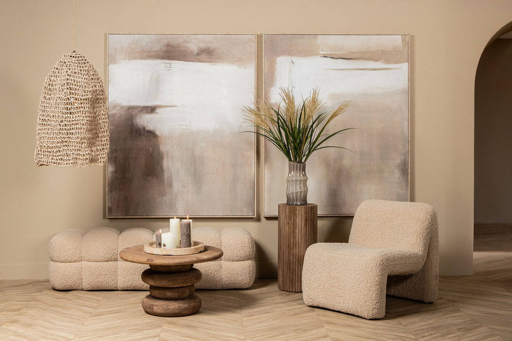 Beige polyester fauteuil Oslo van PTMD met een moderne, zachte uitstraling in een stijlvol ingericht interieur.
