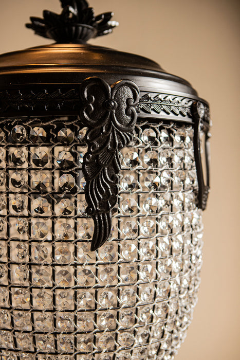 PTMD Lidde hanglamp met grijs glas, gedetailleerde ornamenten en een elegant ovaal design.