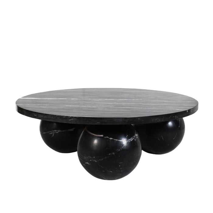 Ronde zwarte salontafel Diro van PTMD gemaakt van marmer met een uniek bolvormig onderstel van 99 cm breed.